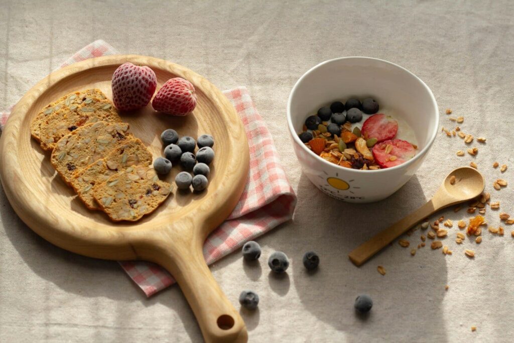 brown wooden spoon with red and black berries